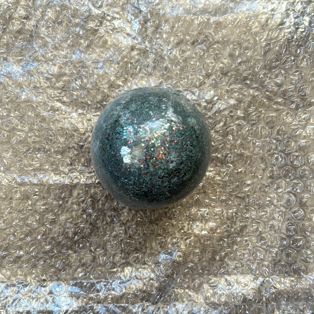 Charmed Aroma surprise bath bomb charcoal grey black